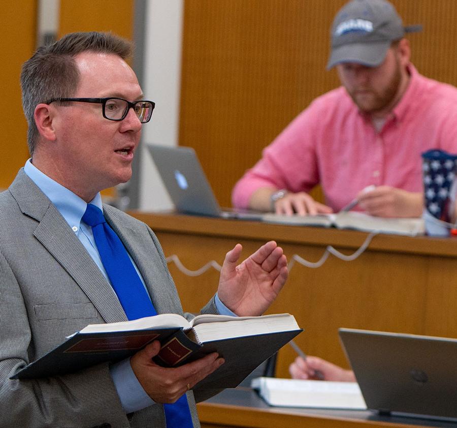 Gaughan teaching in a lecture hall.