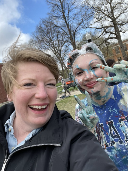 Two women smiling at Painted Street during Relays.